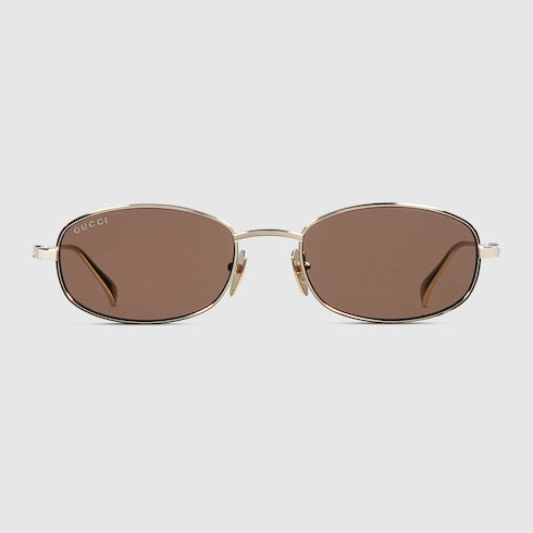 Occhiali da sole ovali in metallo color oro chiaro lucido