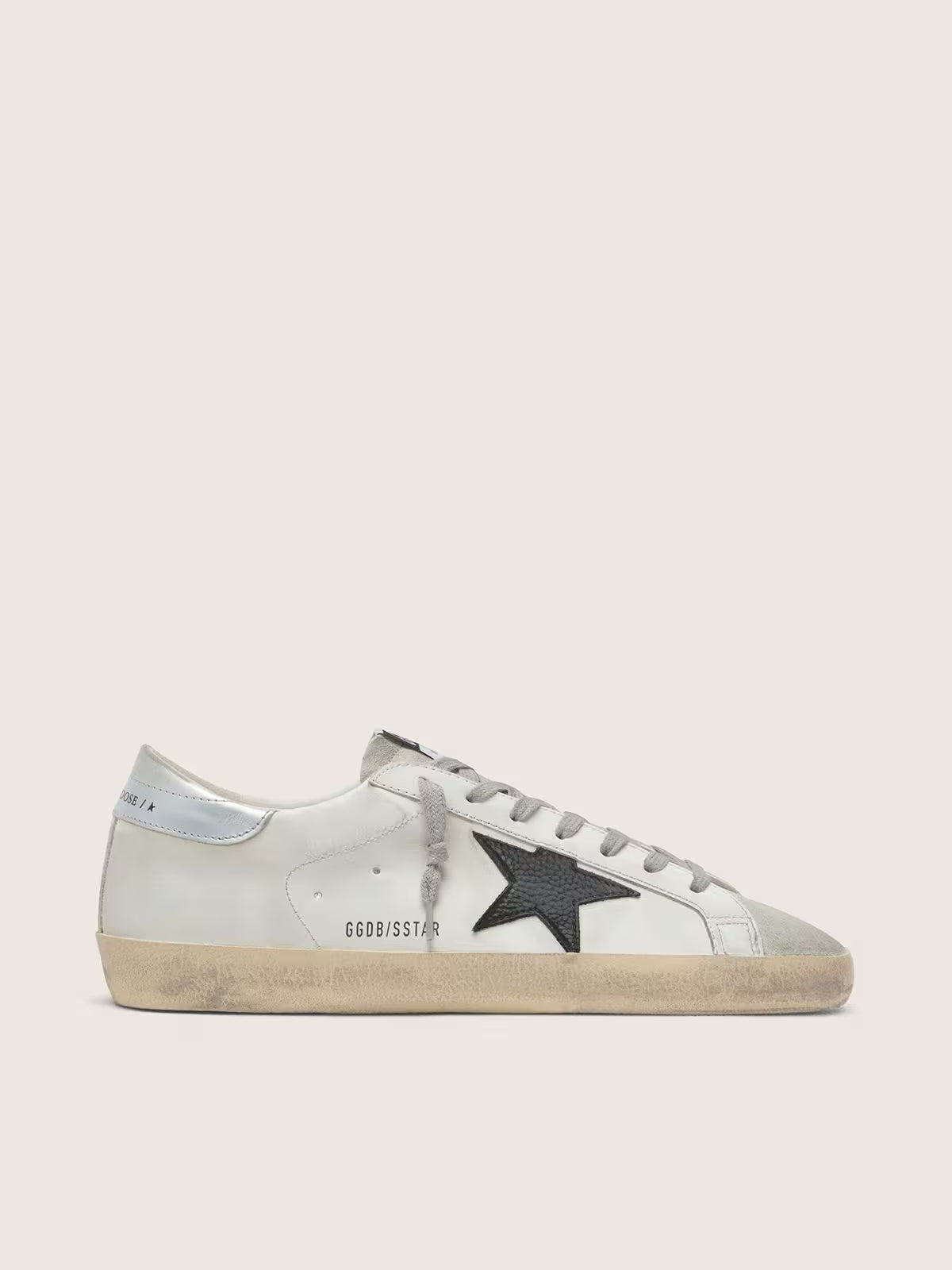 Pelle bianca con stella in pelle nabuk nera e talloncino in pelle laminata argento