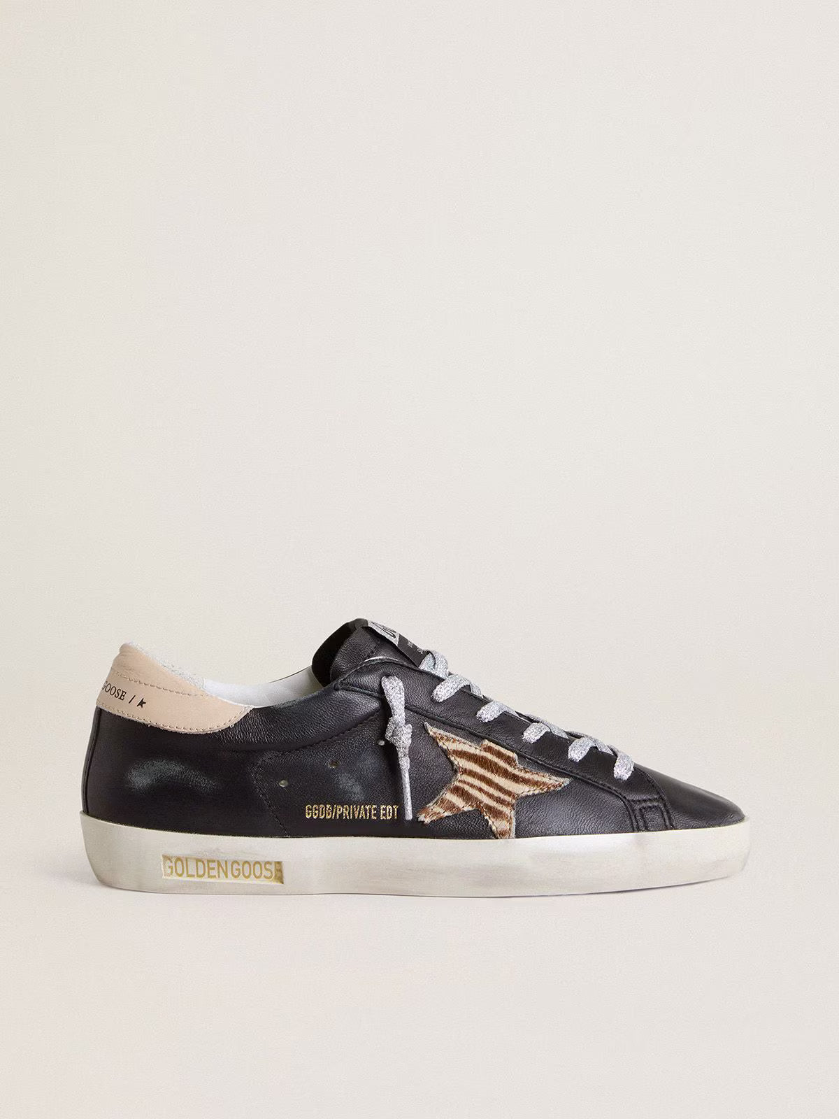Nappa nera con stella in cavallino zebrato e talloncino in pelle beige