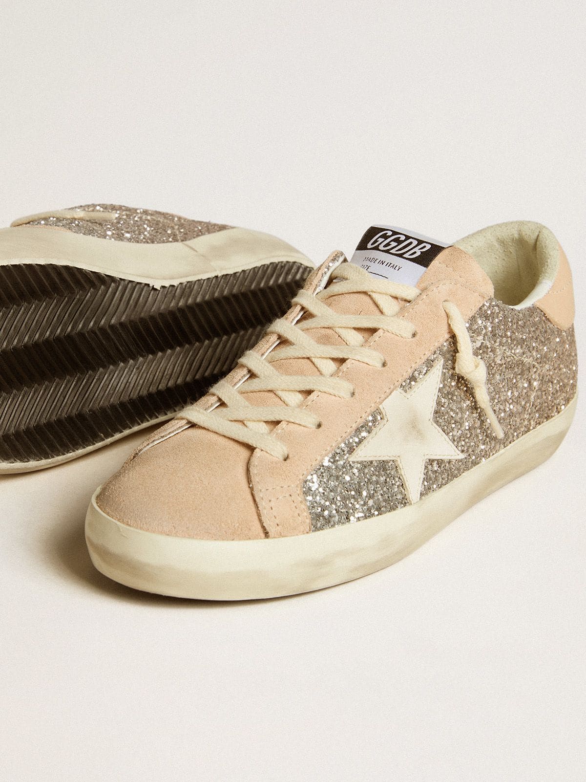Glitter argento con stella e talloncino in pelle