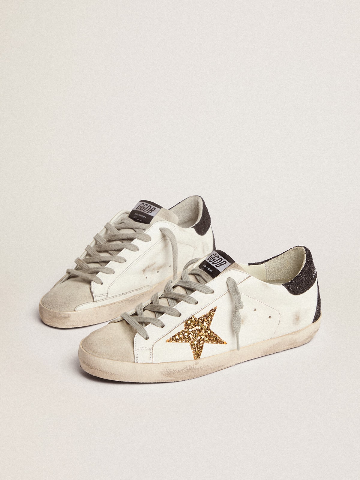 LTD con stella dorata e talloncino nero in glitter
