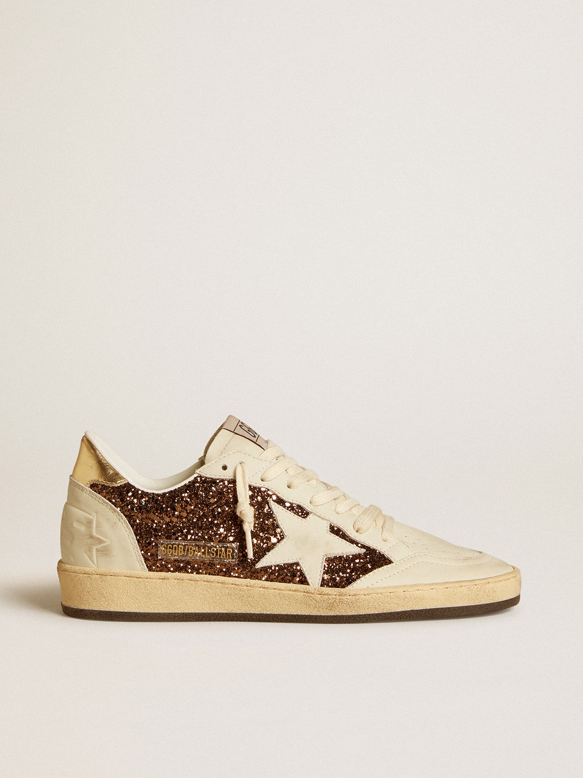 Glitter con stella in pelle e talloncino in pelle laminata