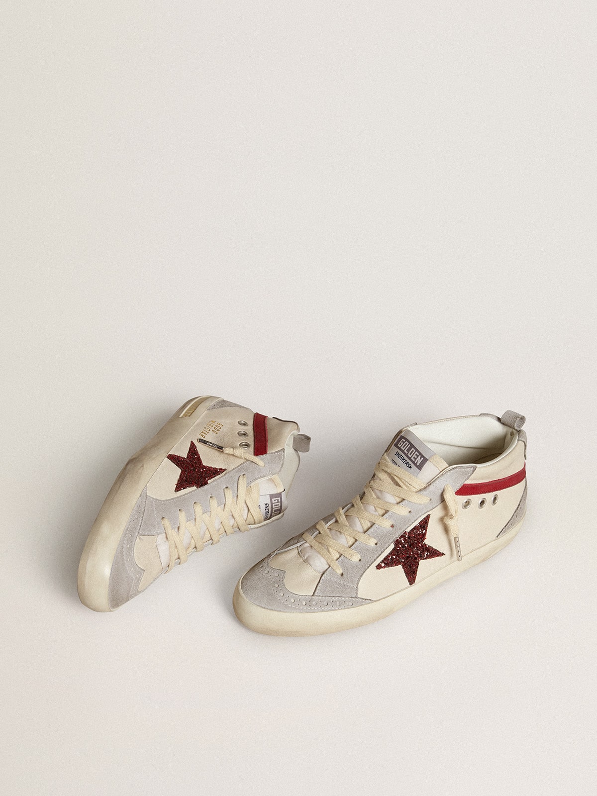 Pelle con stella in glitter e virgola in nabuk rosso
