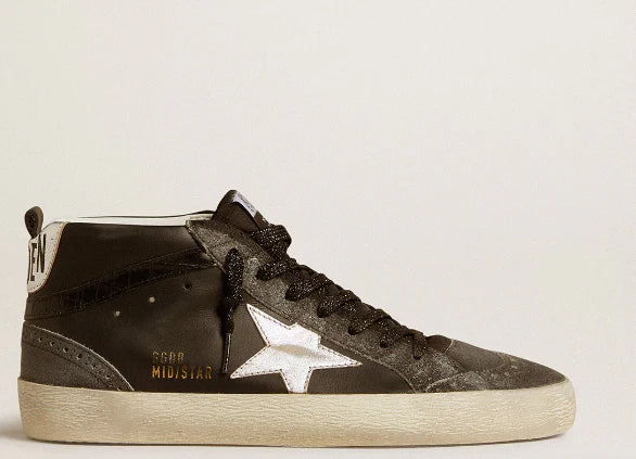 Pelle nera con stella in pelle laminata argento